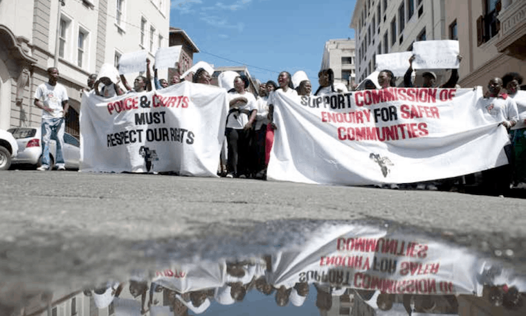 Members of the Social Justice Coalition protest outside the High Court
